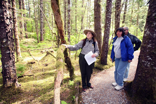 A park ranger gives visitors a briefing about a portion of Glacier Bay National Park in Alaska.
