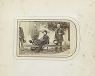 Drie mannen en een vrouw in een draagstoel in Ischl