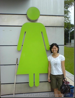 She with toilet sign
