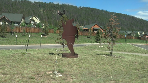 Bear and Man Sculpture