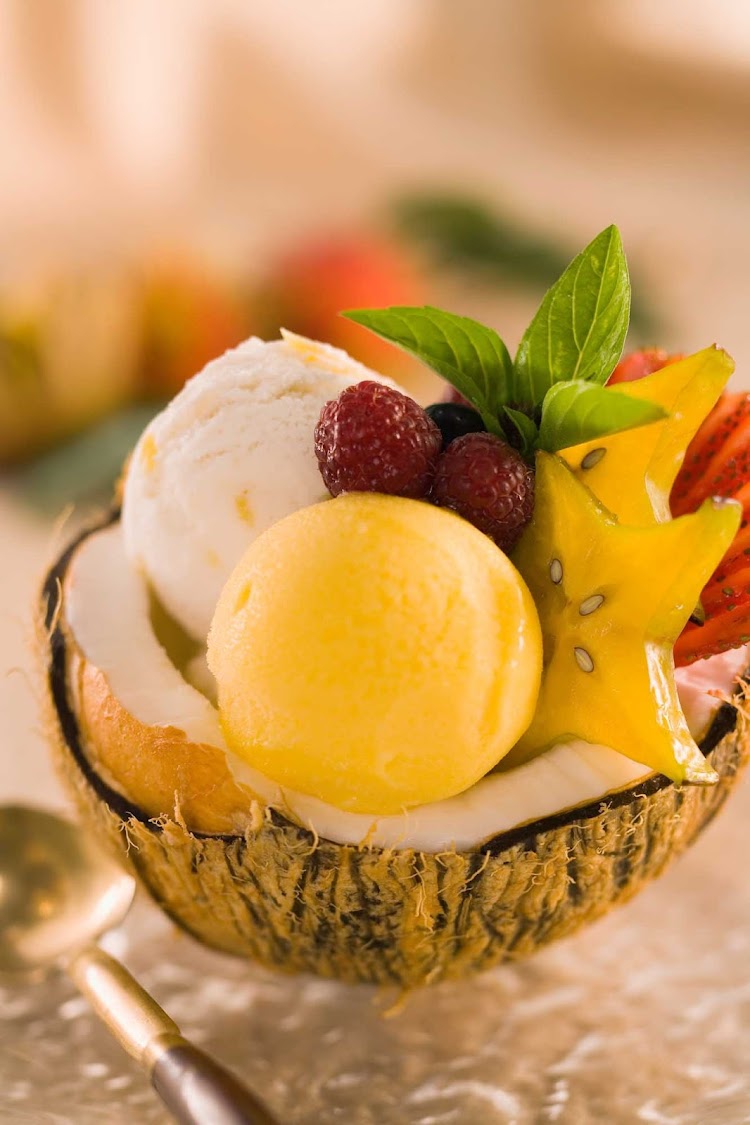 Cool off with a coconut sorbet with fruit and sauce.