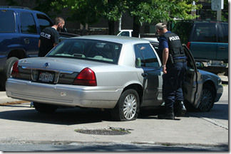 Police looking at the suspect's car