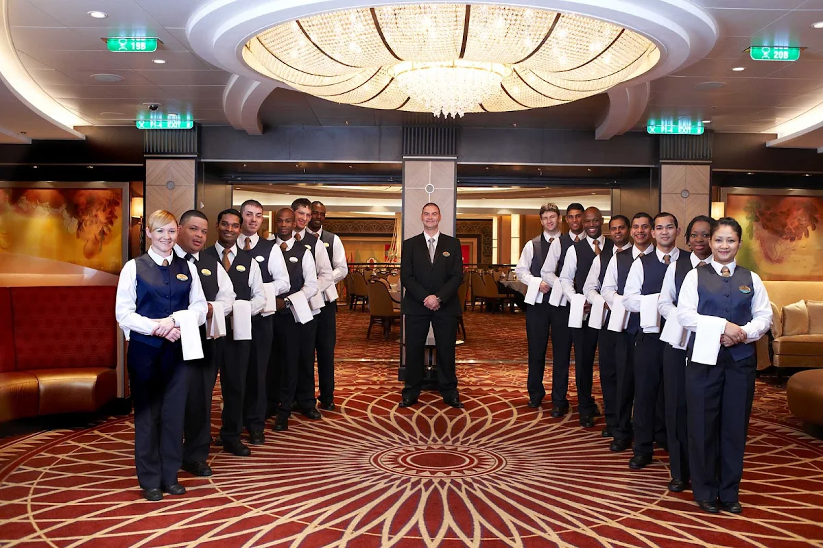 Royal-Caribbean-wait-staff - The staff in the dining rooms on Royal Caribbean cruises are charged with making sure that all dishes meet exacting standards.
