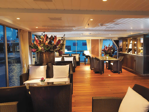 AmaDolce-Aft-Lounge - Spend your afternoon in the casual lounge of the AmaDolce cruise ship as you take in the expansive views of European waterways.
