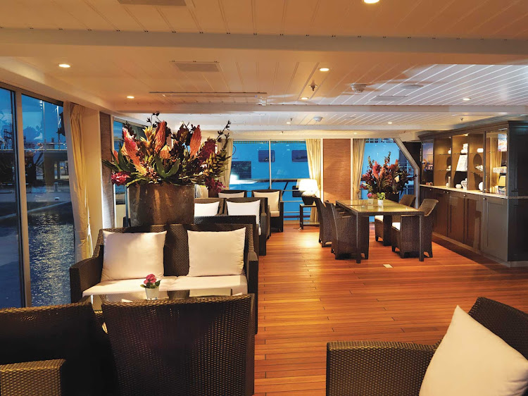 Spend your afternoon in the casual lounge of the AmaDolce cruise ship as you take in the expansive views of European waterways.