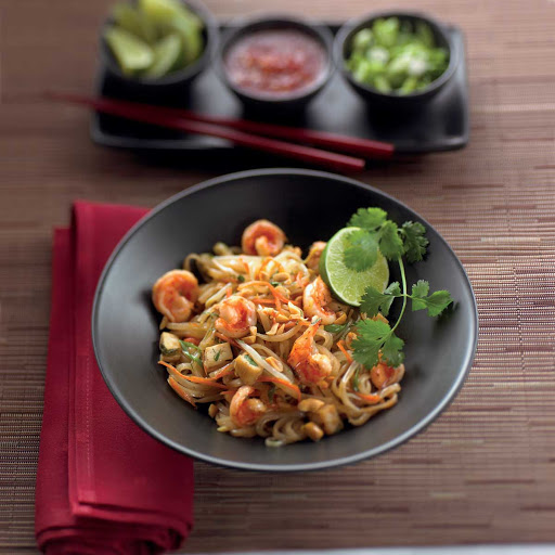 Spicy pad Thai garnished with fresh lime at Silk Harvest on the Celebrity Solstice and Celebrity Equinox.