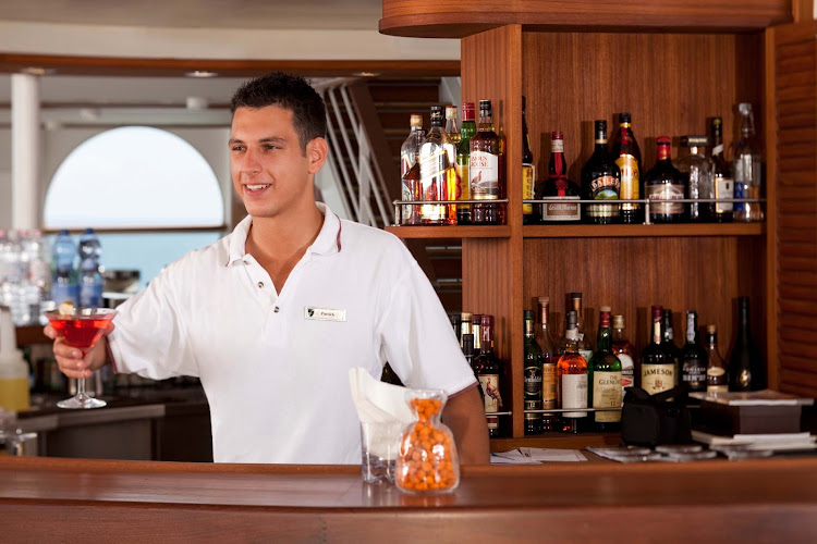 At the Sky Bar on Seabourn Quest, you'll find open air drinking, entertainment and attentive bartenders.