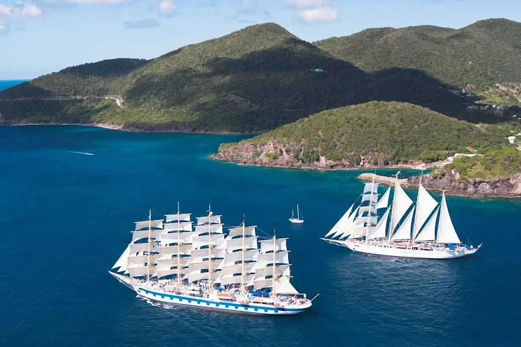 Royal Clipper, foreground, the largest and only five-masted full-rigged sailing ship built since 1902, sails alongside a sister ship.