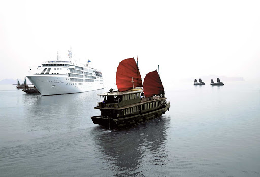 Silver_Cloud_in_Vietnam - In Ha Long Bay, Vietnam, Silver Cloud passes an eye-popping junk. Junk ships were used as ocean-going vessels from as early as the 2nd century AD. 