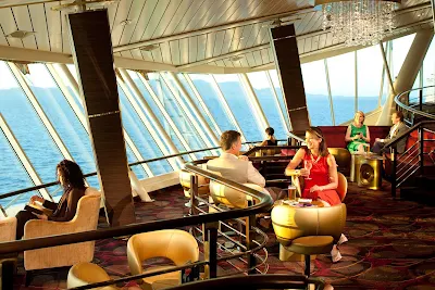 In the evening, the Viking Crown Lounge, at the top of Grandeur of the Seas, transforms from a quiet observation point to a lively adults-only nightclub.