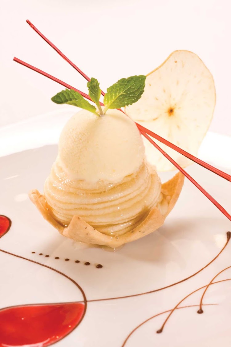 Enjoy Prime 7 Restaurant's classic desserts with a modern twist, such as apple pie à la Mode, during your journey aboard Seven Seas Voyager.