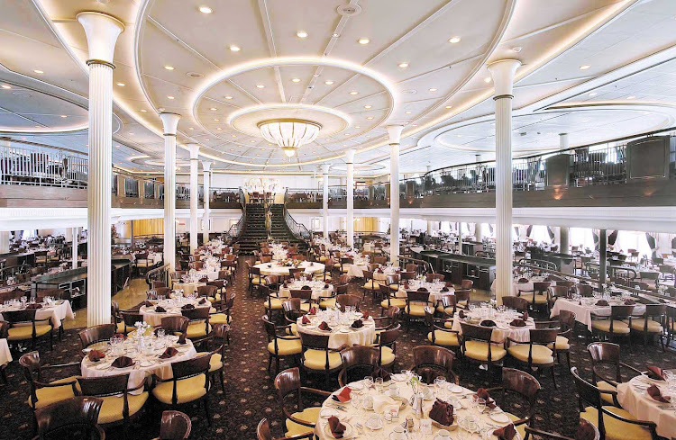 Dine on steak, duck, seafood or vegetarian fare in My Fair Lady, Enchantment of the Seas's main dining room on decks 4 and 5.
