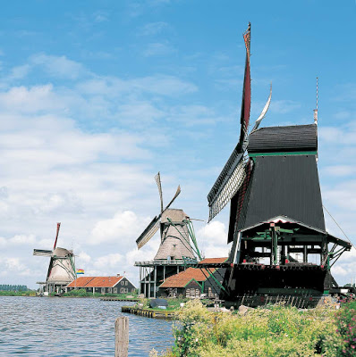 Windmills line the landscape at Zaanse Schans, a popular attraction for visitors near Amsterdam.
