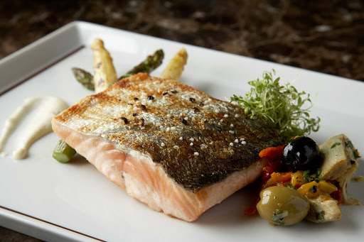 Crispy skinned salmon prepared in the Tuscan Grille aboard your Celebrity cruise.