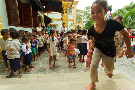 Children in front of the New Hope Cambodia Outreach Centre during a G Adventures expedition of Cambodia.