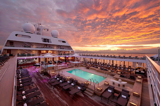 Seabourn_Swimming_Pool_at_Sunrise - Watch the sun rise from the expansive Pool Deck on board Seabourn Sojourn.