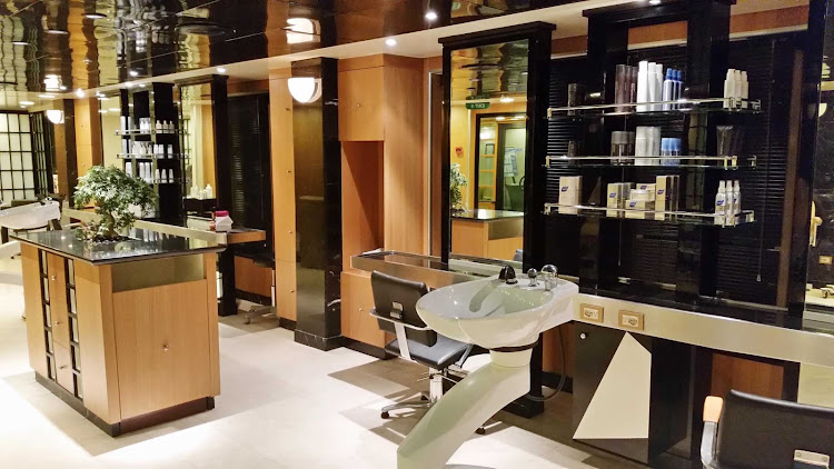 The hair salon, located in the Lotus Spa, deck 16 forward on Emerald Princess.