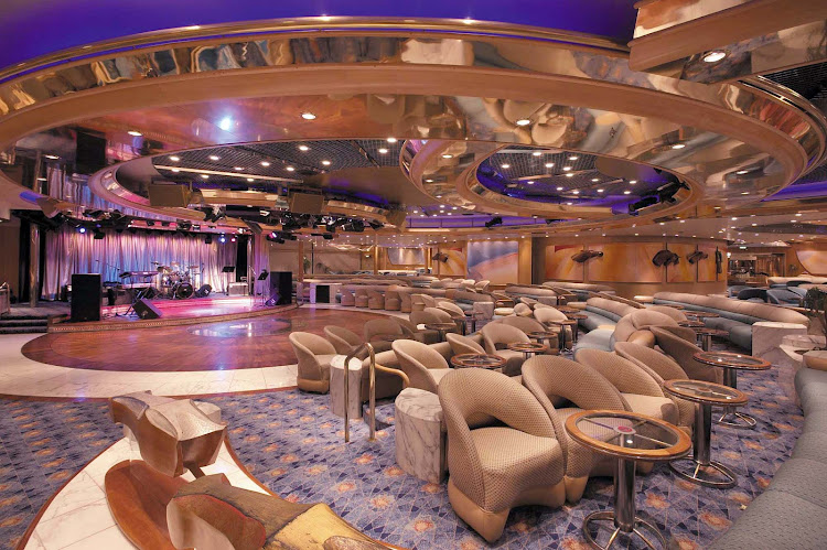 Have a cocktail, meet new friends, dance and listen to live music at Carousel Lounge on Enchantment of the Seas.