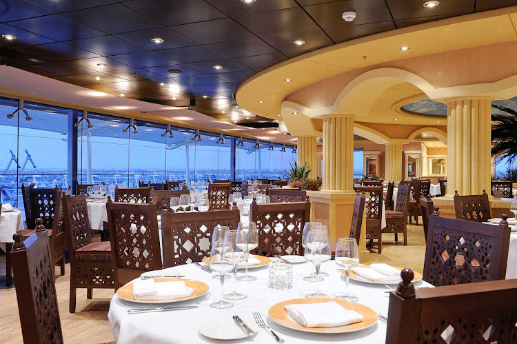 MSC Magnifica's L'Oasi Restaurant offers panoramic views of the passing landscapes and signature dishes designed by two-star Michelin chef Mauro Uliassi.