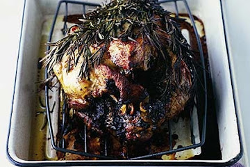 Roast leg of lamb wrapped in rosemary