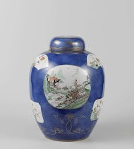 Ovoid covered jar with powder blue and panels in reserve with lanscape, flower basket and antiquities