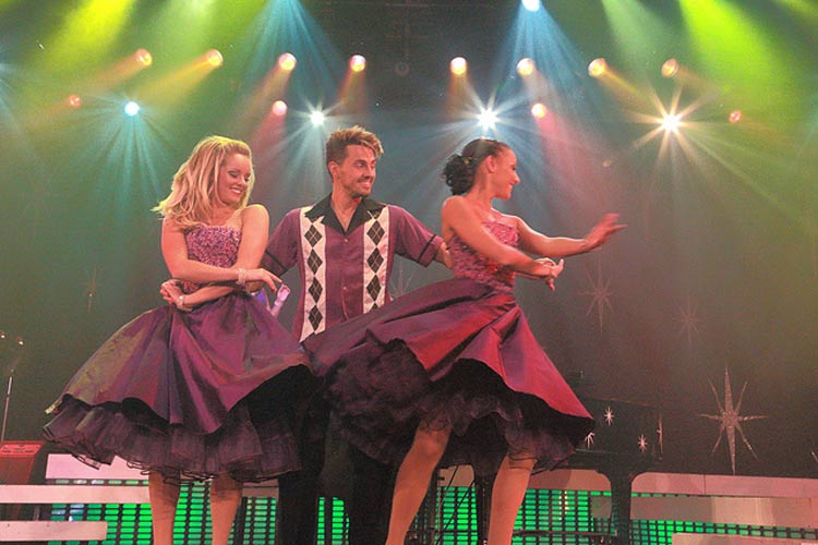 A photo of dancers on Grand Princess, shared via social media. Share your experiences but turn off your app updates and push notifications on your mobile devices during a cruise.