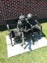 Boy and Girl Reading Bench