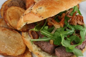 Horseradish Crusted Steak Sandwich with Arugula and Crispy Shallots
