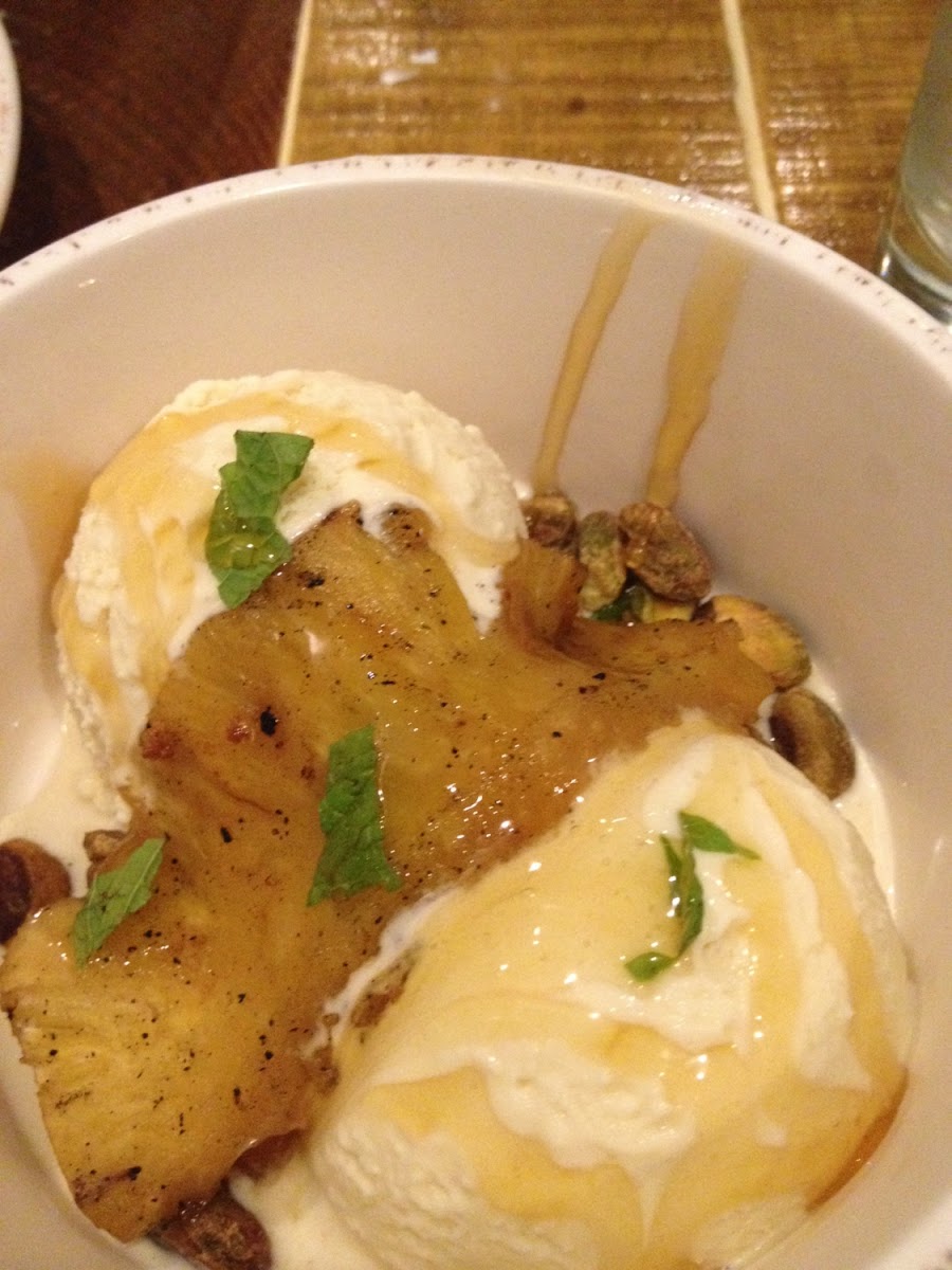 Coconut ice cream with honey, mint, and pistachios