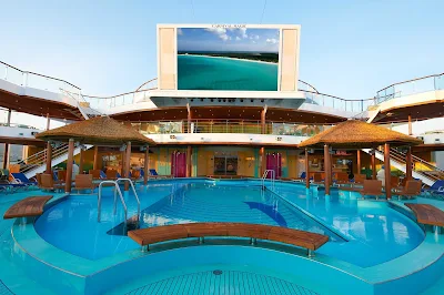 Seaside Theater's large LED screen, positioned over Carnival Magic's Beach Pool, shows movies, concerts and sporting events.