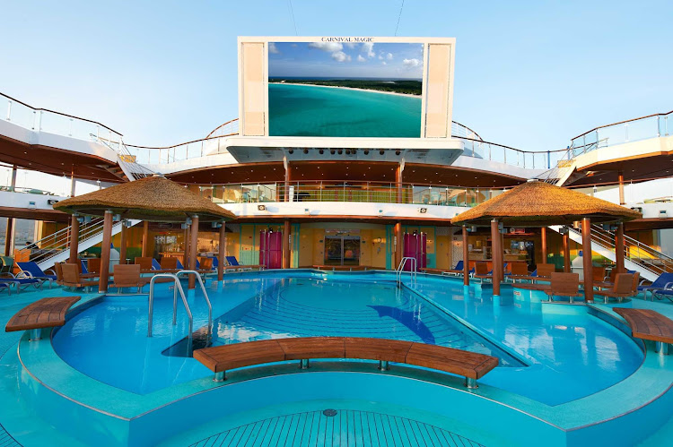 Seaside Theater's large LED screen, positioned over Carnival Magic's Beach Pool, shows movies, concerts and sporting events.