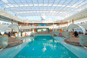 Guests can enjoy a dip in La Grotta Azzurra, MSC Magnifica's tranquil azure-colored indoor pool, during their cruise.