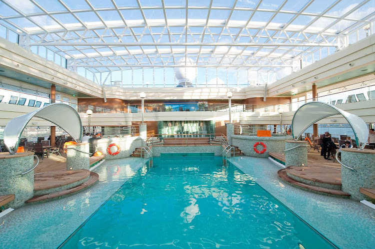 Guests can enjoy a dip in La Grotta Azzurra, MSC Magnifica's tranquil azure-colored indoor pool, during their cruise.