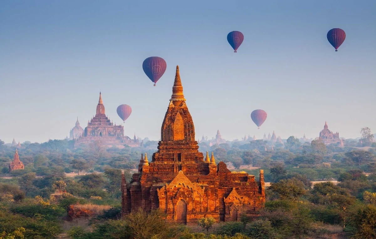 Myanmar-temples-and-hot-air-balloons - Hot air balloons hover above some 3,000 Buddhist temples during a sunrise flight in Bagan, Myanmar. You can now visit Bagan, Yangon, Mandalay and other breathtaking sites aboard AmaWaterways' luxury river cruise ship the AmaPura.