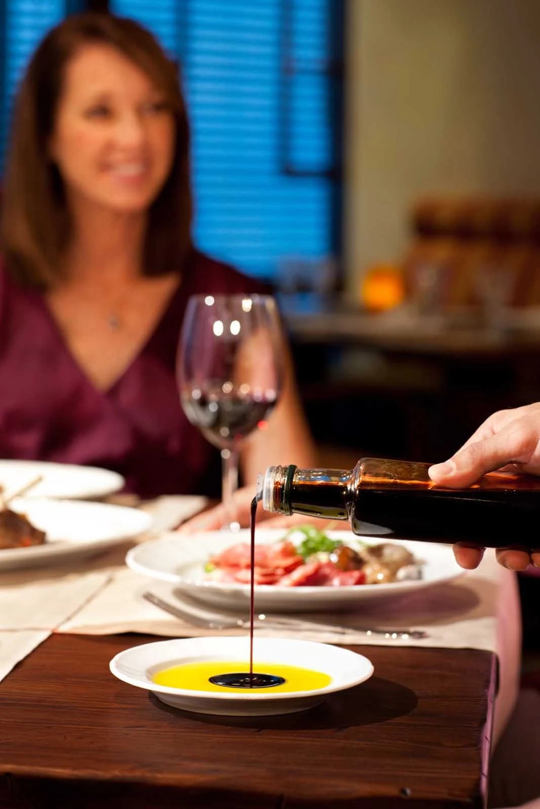 Grandeur-of-the-Seas-Giovannis-Table - Giovanni's Table, a family-style trattoria aboard Grandeur of the Seas, offers rustic Italian dishes with a contemporary flair.