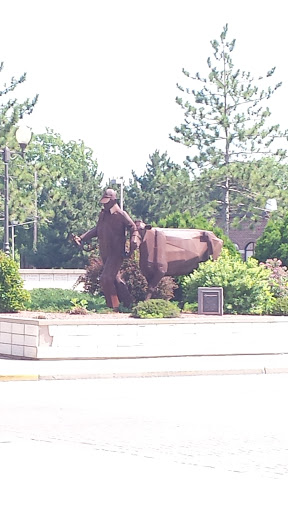 Farmer Bull Statue 