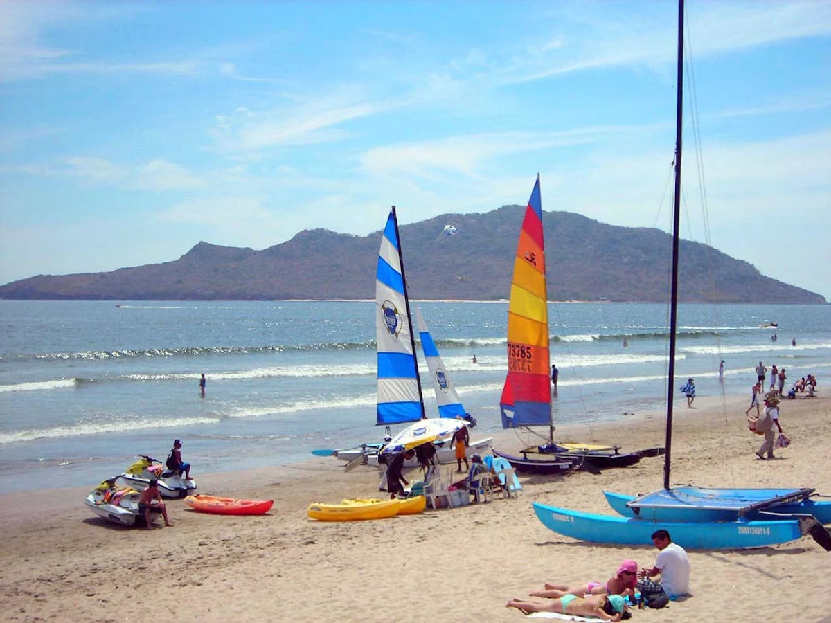 sails-beach-Mazatlan-Mexico - Sailboarders and catamarans on the beach in Mazatlan, Mexico.