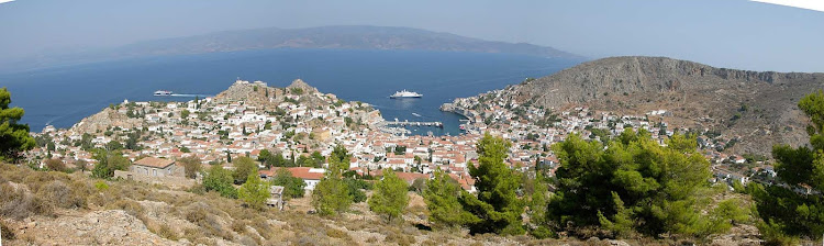 A SeaDream ship stops for guests to visit the harbor of Hydra, Greece.