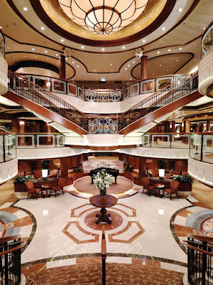 Queen Victoria's stately Grand Lobby features a double sweeping staircase, sculpted balconies and a ceiling that extends three decks high. 