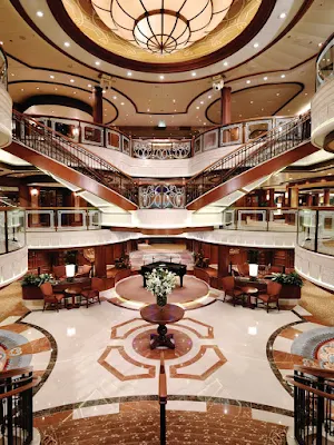 Queen Victoria's stately Grand Lobby features a double sweeping staircase, sculpted balconies and a ceiling that extends three decks high. 