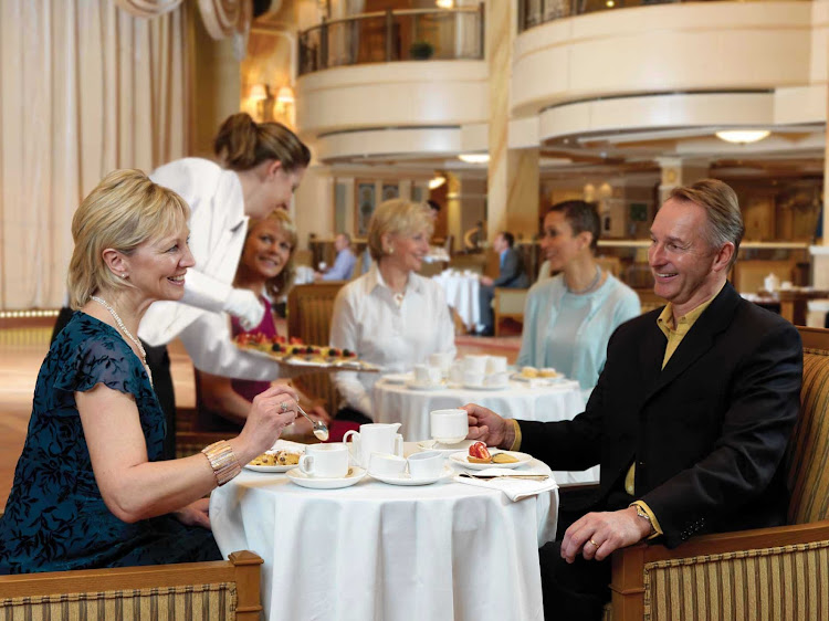 Have a warm cup of afternoon tea while listening to a live orchestra aboard Queen Victoria.