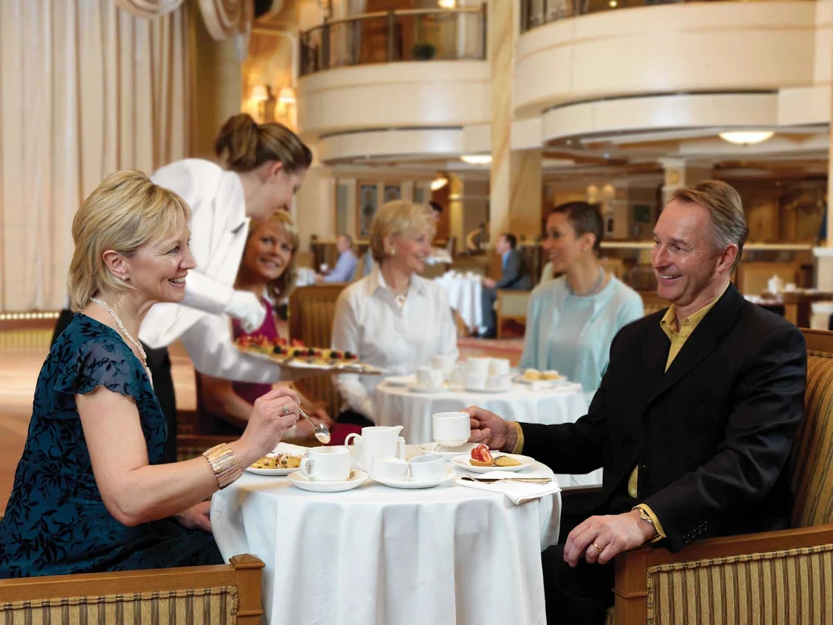 Cunard-Queen-Victoria-afternoon-tea - Have a warm cup of afternoon tea while listening to a live orchestra aboard Queen Victoria.
