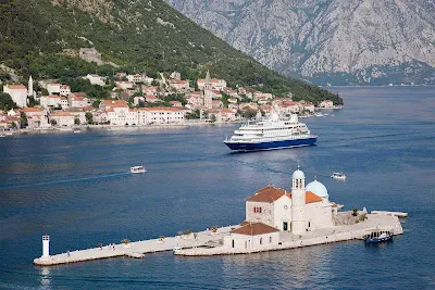 SeaDream II sails through the harbor of historic Kotor, Montenegro.