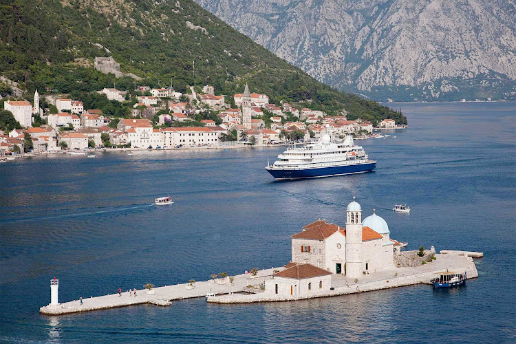 SeaDream II sails through the harbor of historic Kotor, Montenegro.