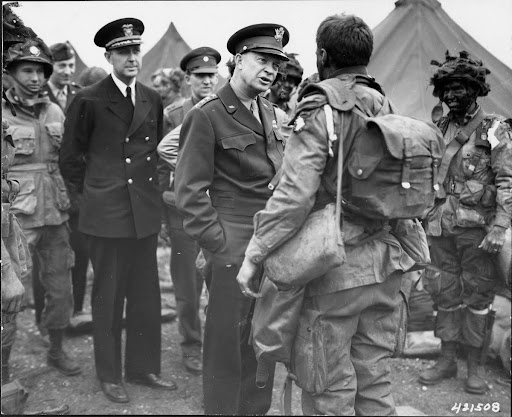 General Eisenhower speaks with paratroopers. June 5, 1944. - Dwight D