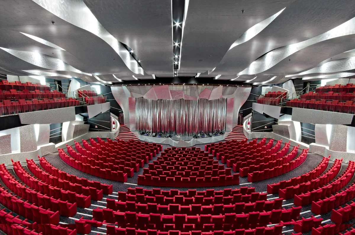 MSC-Divina-Pantheon-Theatre - Top off your evening on MSC Divina with entertainment in the glitzy, 1,600-seat Pantheon Theatre with its stunning looks and acoustics. On decks 6 and 7, it features Broadway-style productions, illusionists, ice shows and more. By day it hosts  conferences and the occasional Bingo game.