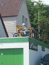 Motorcycle On A Roof