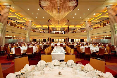 Enjoy dinners in the lavish Blush Dining Room during your cruise on Carnival Breeze.