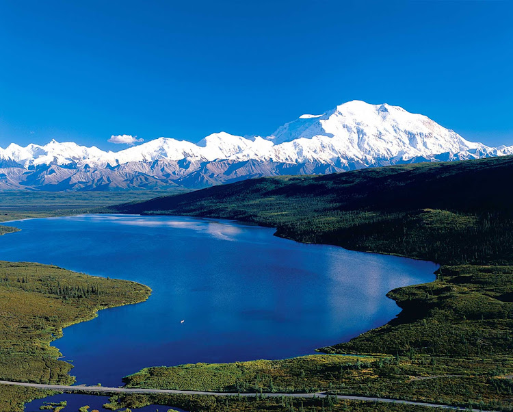 Throughout the day, lakes and mountain vistas create beautiful landscapes in Denali National Park, Alaska.