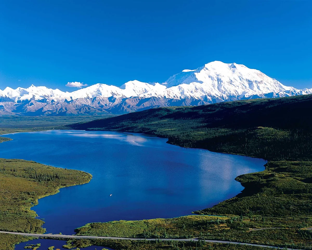 lake-mountain-Denali - Throughout the day, lakes and mountain vistas create beautiful landscapes in Denali National Park, Alaska.